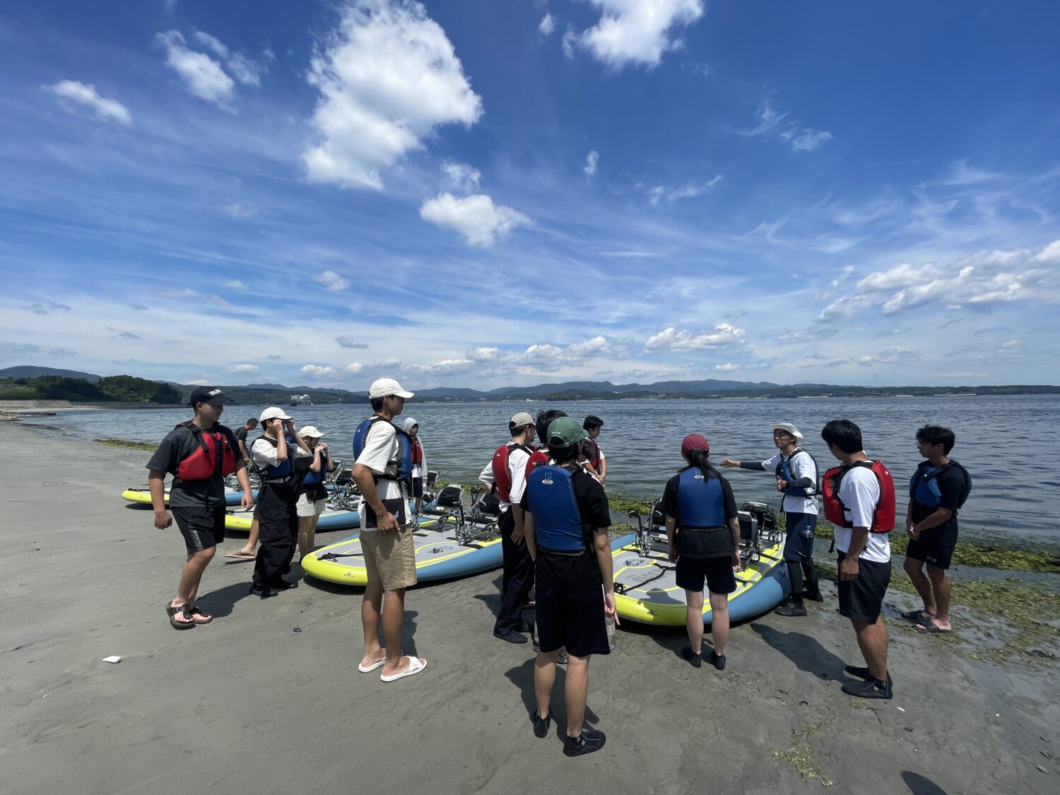 Participants receiving a friendly and thorough safety briefing from an expert guide before starting their Hobie kayak adventure