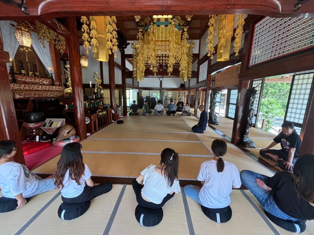 A peaceful moment of meditation and mindful breathing inside a historic Japanese temple