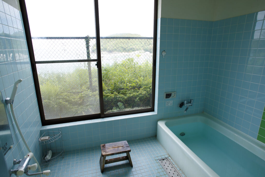 A relaxing and clean Japanese-style bath for guests to unwind at the guesthouse