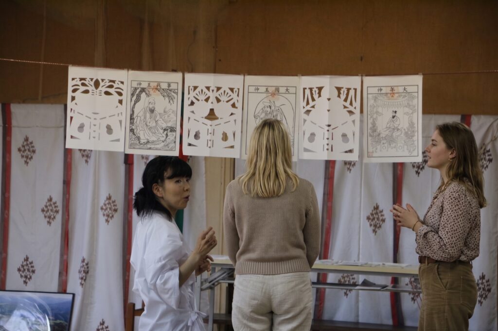 Learning the sacred history and techniques of Kiriko from a local instructor