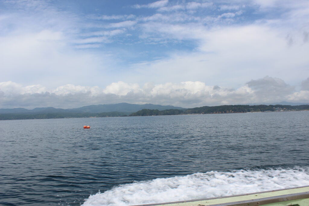 Beautiful scenic view of Shizugawa Bay taken from aboard the cruising fishing boat