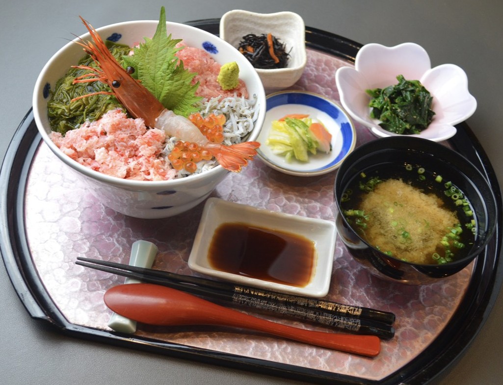 Premium seafood bowl topped with fresh local specialties